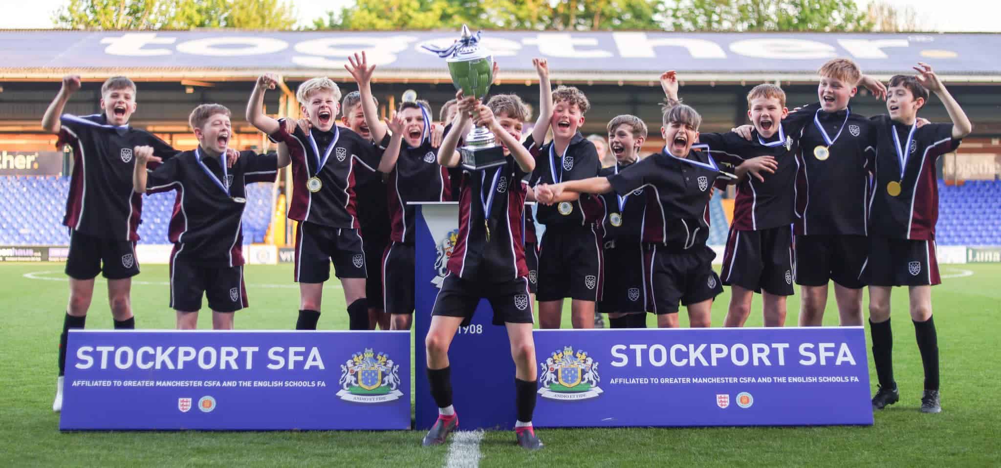 Hazel Grove High School Year 7 football team celebrate as the Stockport Schools Year 7 League winners.